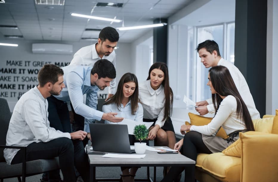 The Trustare team working together in an office